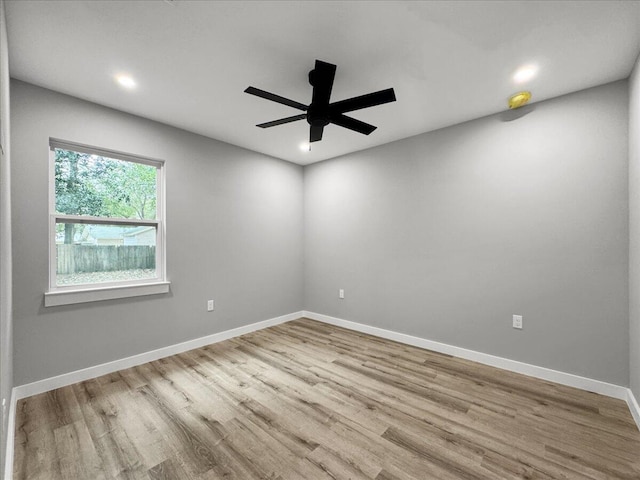 unfurnished room featuring ceiling fan and light hardwood / wood-style floors