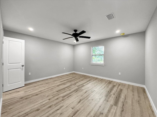 unfurnished room with ceiling fan and light hardwood / wood-style floors