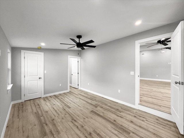 unfurnished bedroom with ceiling fan and light wood-type flooring