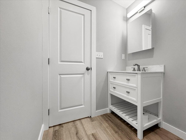 bathroom featuring vanity and wood-type flooring