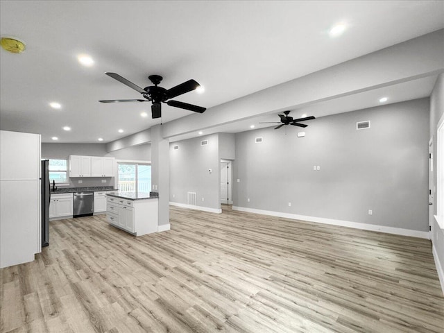 unfurnished living room featuring ceiling fan and light wood-type flooring