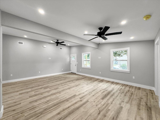 unfurnished room featuring ceiling fan and light wood-type flooring