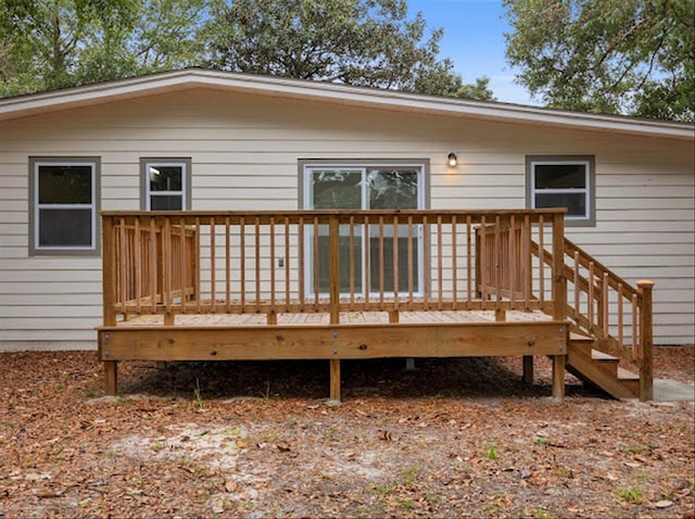 back of property with a wooden deck