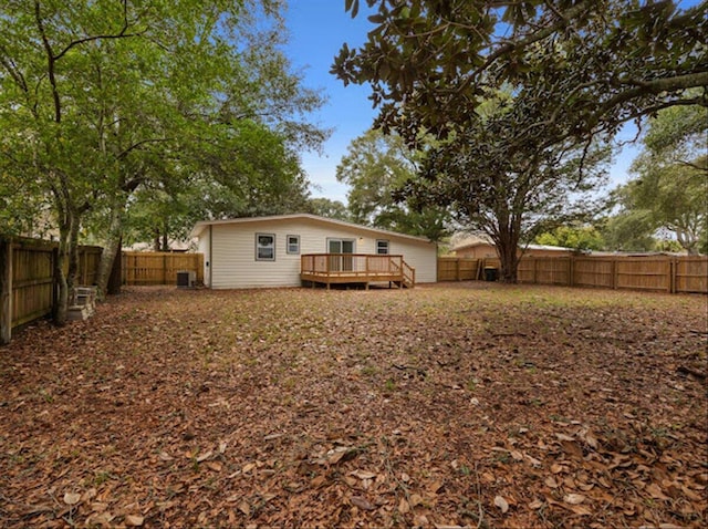 back of house with a wooden deck