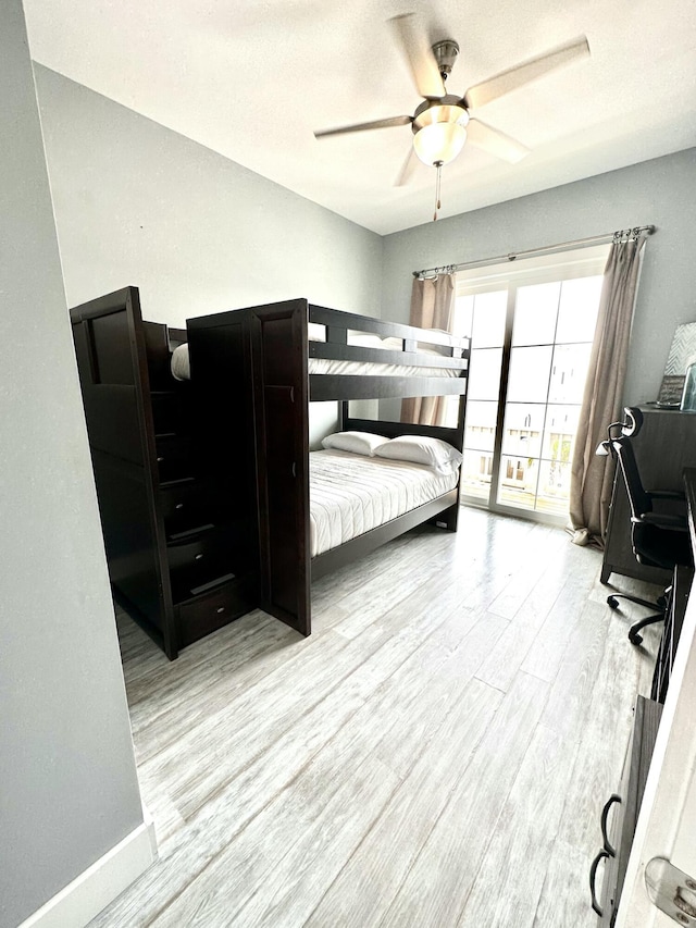 bedroom featuring ceiling fan and light hardwood / wood-style floors