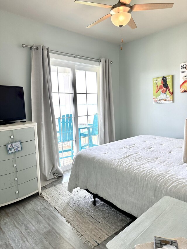 bedroom featuring ceiling fan, access to exterior, and light hardwood / wood-style flooring