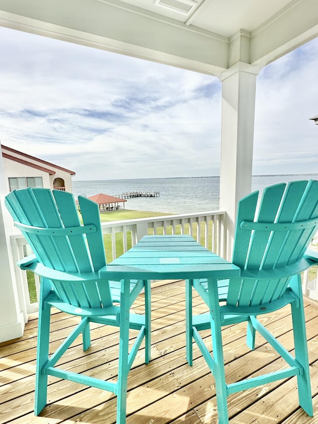 balcony featuring a water view