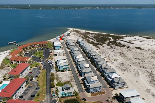 bird's eye view with a beach view and a water view