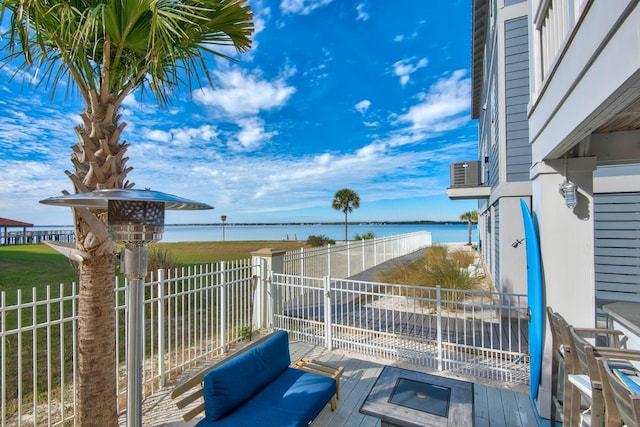 exterior space with a balcony and a water view