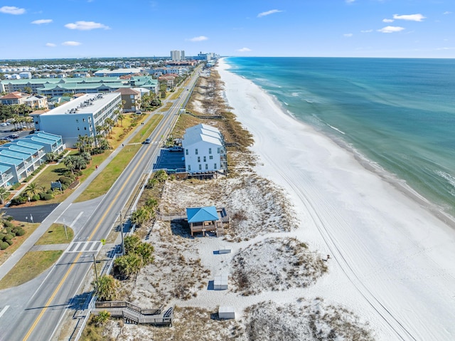 drone / aerial view featuring a water view and a beach view