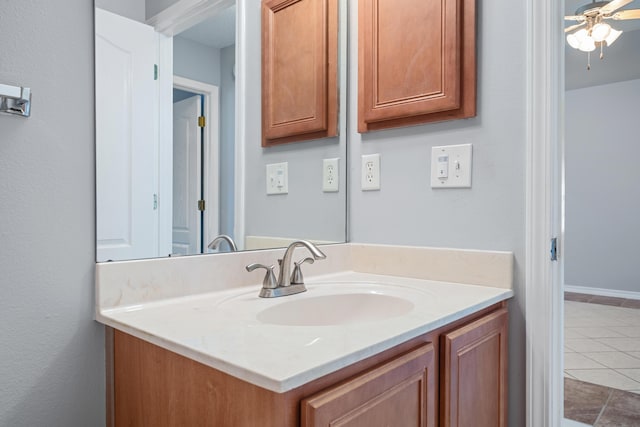 bathroom with tile patterned floors, ceiling fan, and vanity