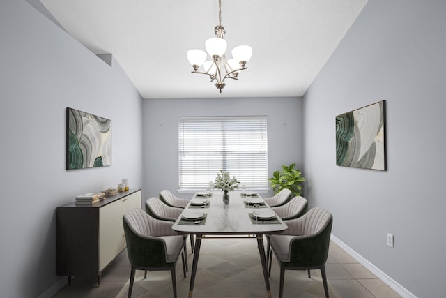 dining room featuring tile patterned floors and a notable chandelier