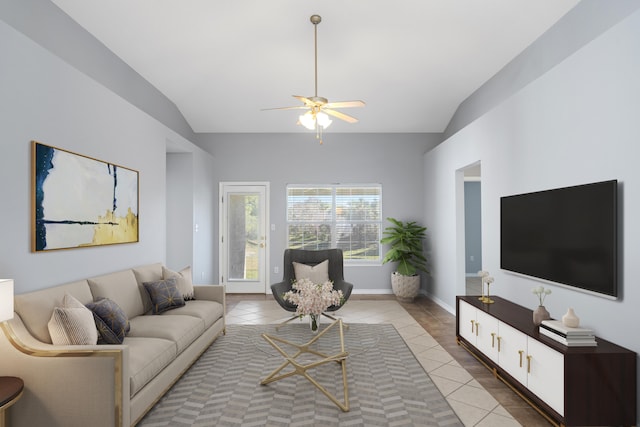 tiled living room featuring ceiling fan and lofted ceiling