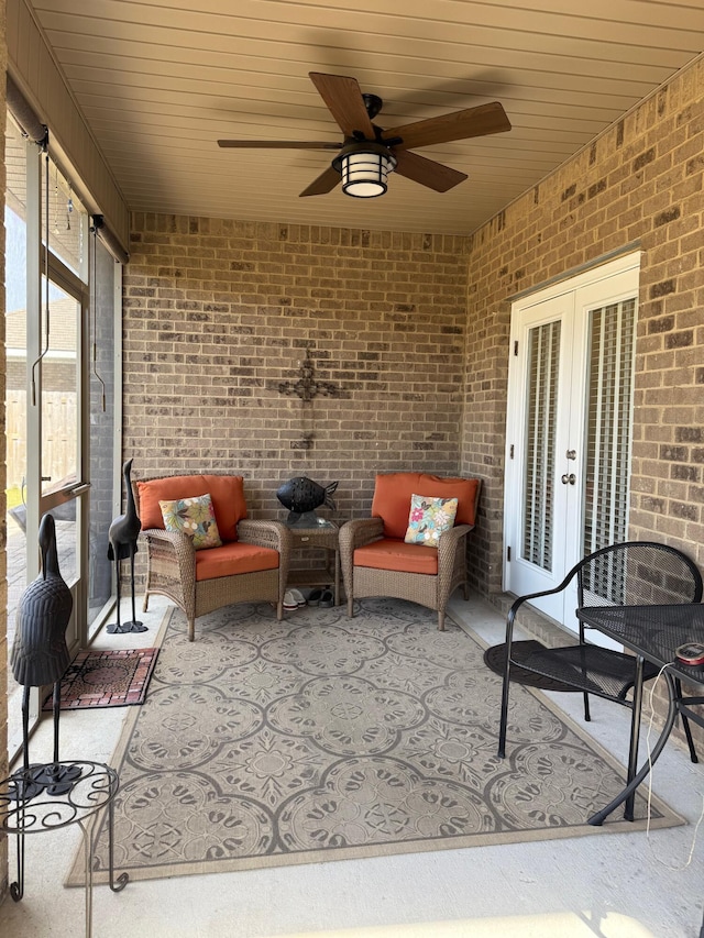 view of patio / terrace featuring ceiling fan and french doors