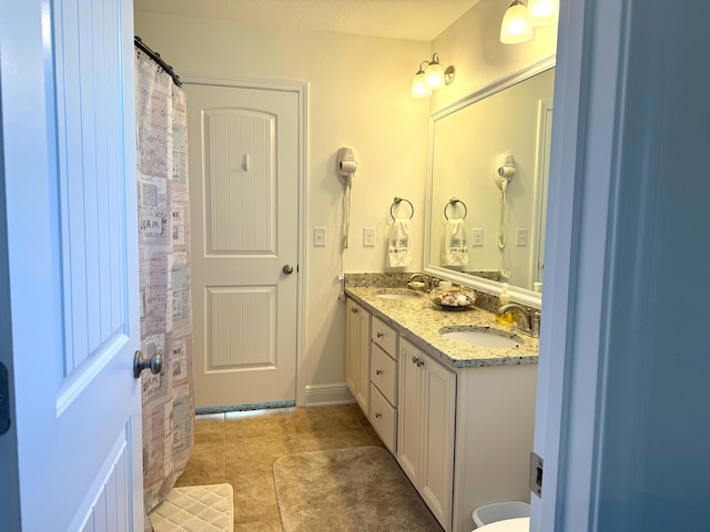 bathroom featuring tile patterned floors and vanity