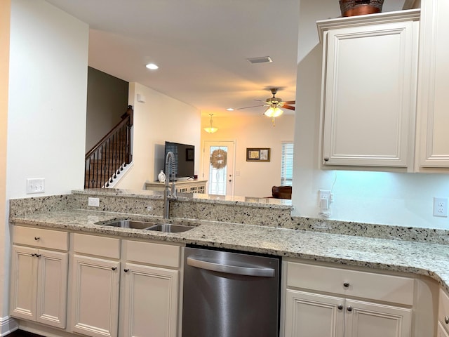 kitchen with ceiling fan, kitchen peninsula, dishwasher, and sink