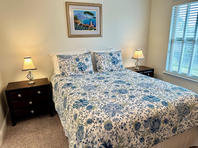 bedroom with light colored carpet