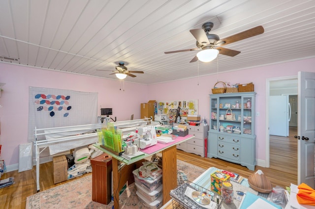 home office featuring ceiling fan and light wood-type flooring