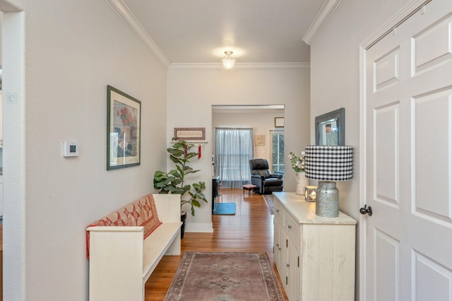 hall featuring hardwood / wood-style flooring and ornamental molding