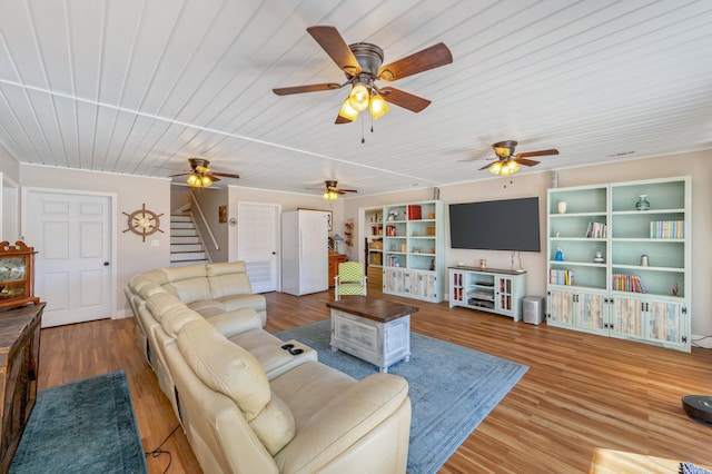 living room featuring wood-type flooring and wood ceiling