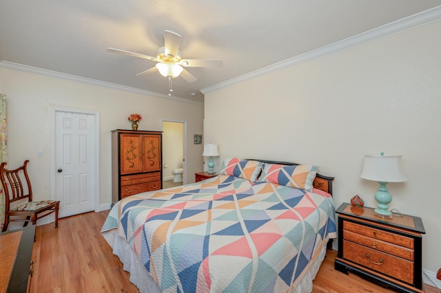 bedroom with ceiling fan, ensuite bathroom, light wood-type flooring, and crown molding