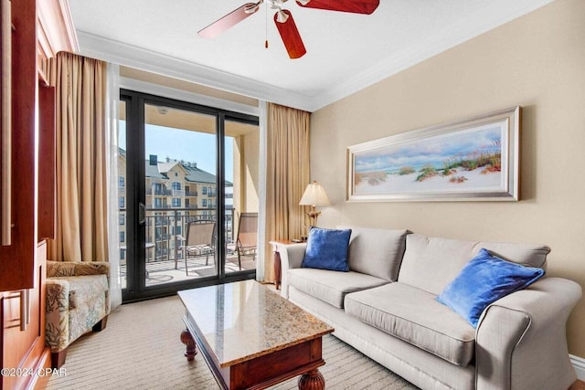 living room featuring a wealth of natural light, ornamental molding, and ceiling fan