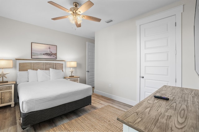 bedroom featuring ceiling fan and dark hardwood / wood-style flooring