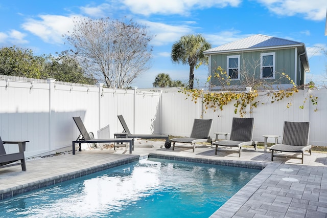 view of pool with a patio area