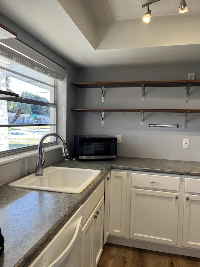 kitchen with sink, stainless steel appliances, dark hardwood / wood-style flooring, and white cabinets