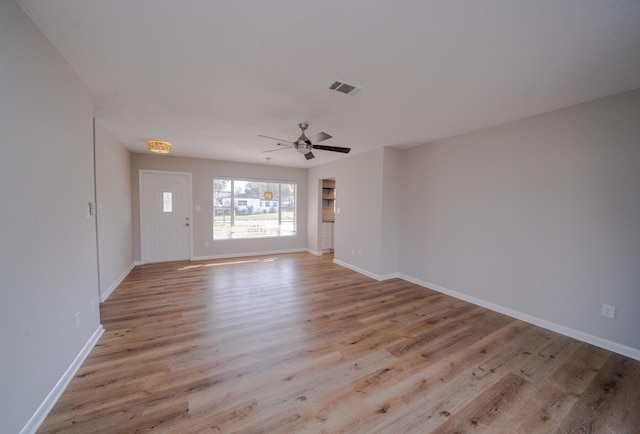 interior space featuring ceiling fan and light wood-type flooring