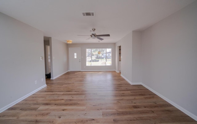 unfurnished room with ceiling fan and light hardwood / wood-style flooring