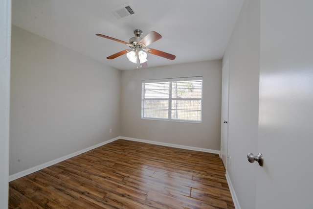 unfurnished room featuring ceiling fan and dark hardwood / wood-style flooring