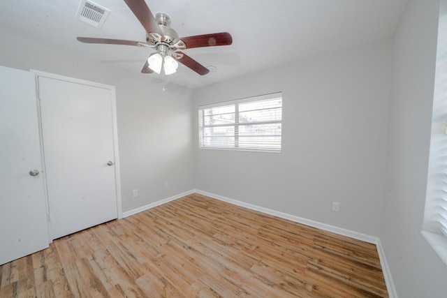 unfurnished room featuring light hardwood / wood-style flooring and ceiling fan