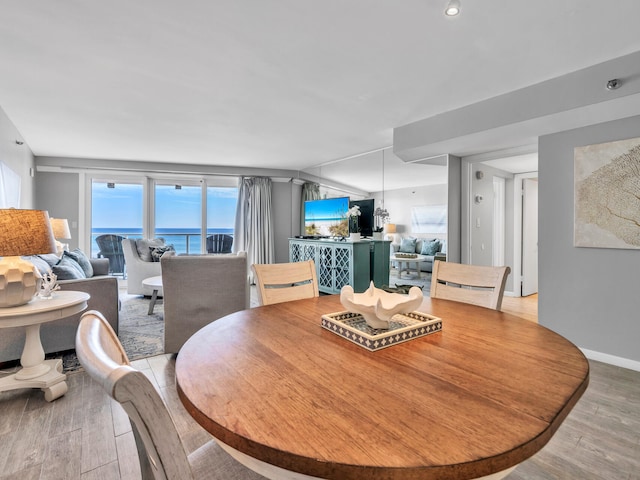 dining space featuring light wood-type flooring