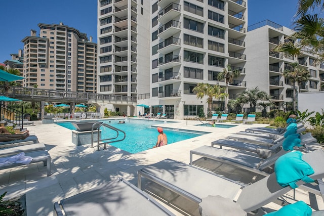 view of pool featuring a patio