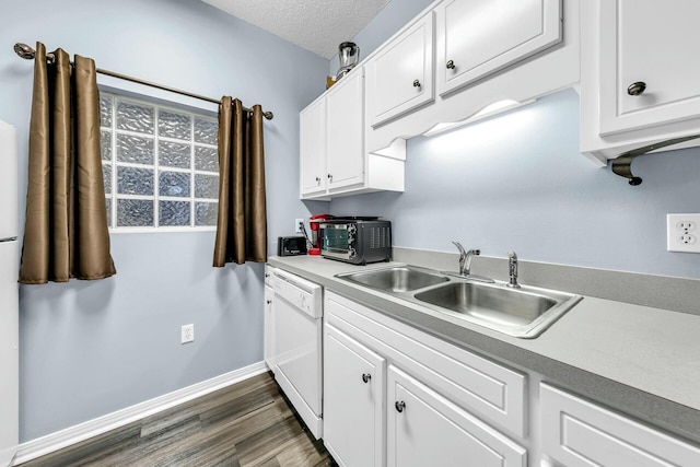 kitchen featuring sink, a textured ceiling, white cabinets, and dishwasher