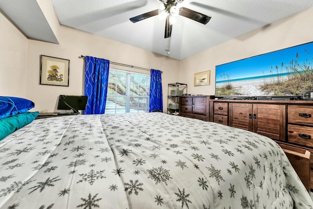 bedroom featuring a textured ceiling and ceiling fan