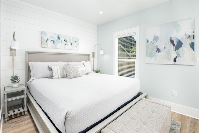 bedroom with hardwood / wood-style floors