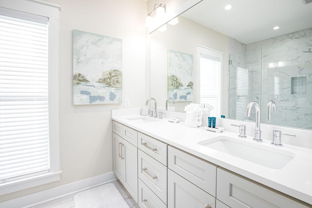 bathroom featuring tile patterned floors, a wealth of natural light, vanity, and a shower with shower door