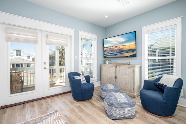 living area featuring light hardwood / wood-style floors