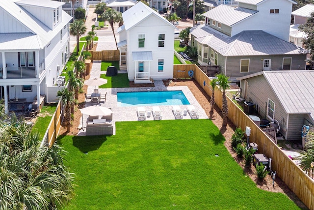 exterior space featuring a lawn, a patio area, outdoor lounge area, and cooling unit