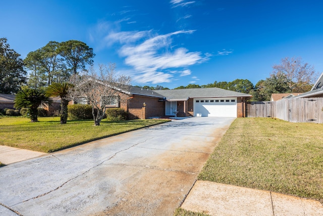 ranch-style home featuring a garage and a front yard