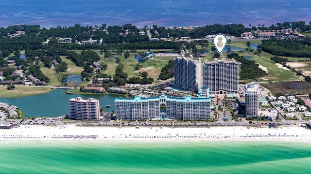 drone / aerial view featuring a water view and a beach view