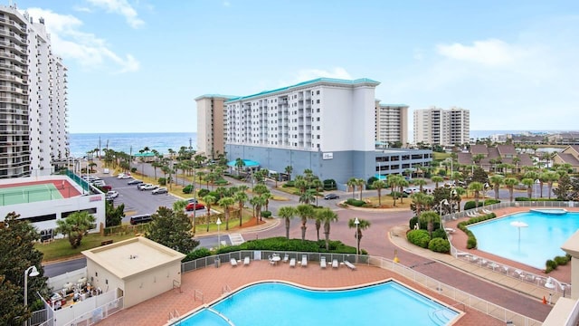 view of pool featuring a water view