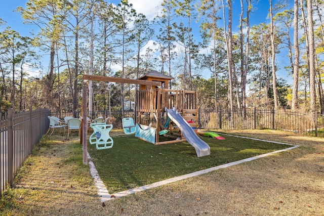 view of playground with a lawn