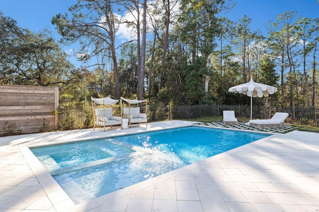 view of swimming pool with a patio area