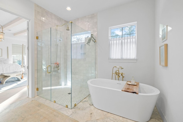 bathroom featuring separate shower and tub