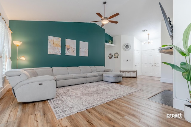 living room featuring light wood-type flooring, high vaulted ceiling, and ceiling fan