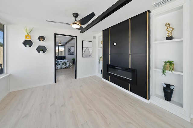 foyer featuring ceiling fan and light hardwood / wood-style flooring