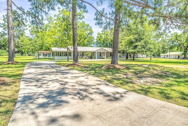 ranch-style house with a front yard